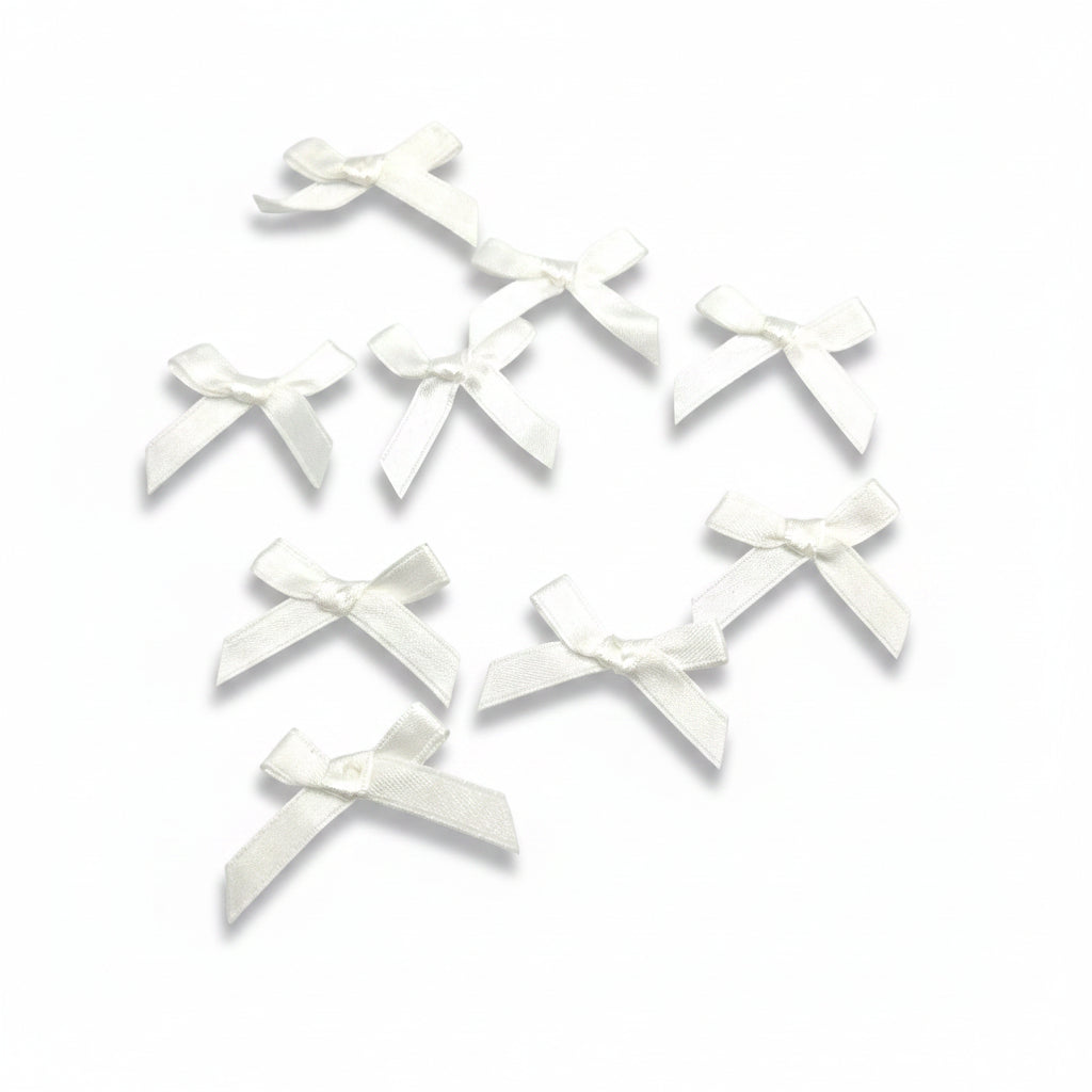 Kleine ecrufarbene Schleifen (20x30mm)